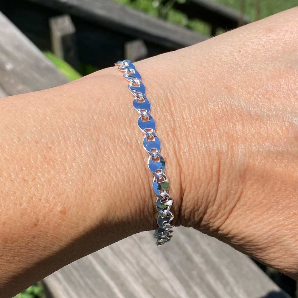 Silver plated link chain bracelet. 6 mm wide; 7.5 inches long. 
Brand new.